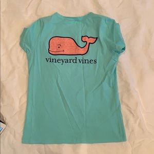 Teal shirt with pink whale logo